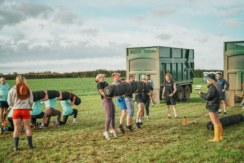 Athletes lined up before a workout in the bottom field