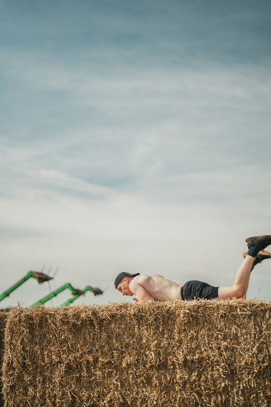 Catching breath beside the hay bales